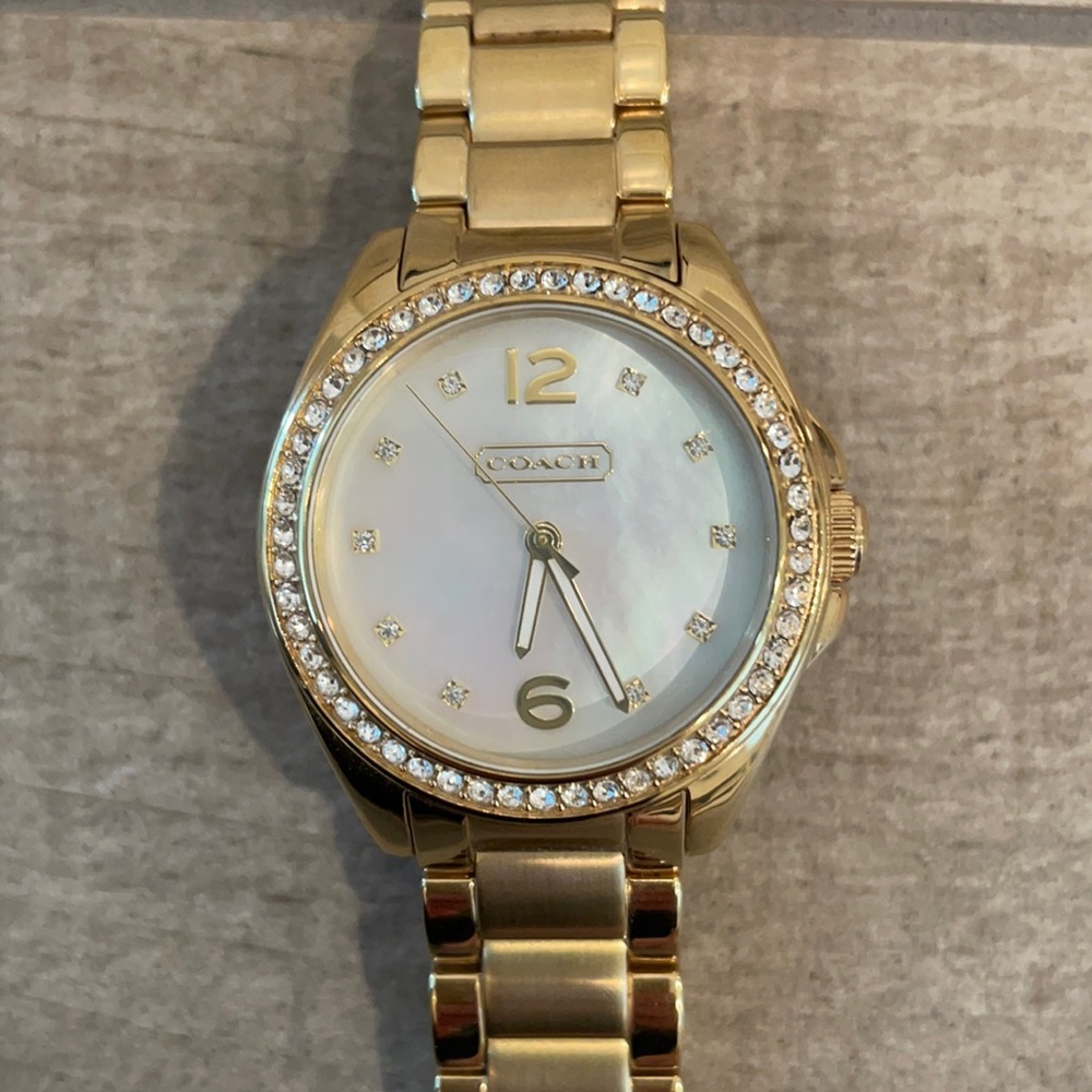 Gold Coach watch. Needs new battery. Never worn